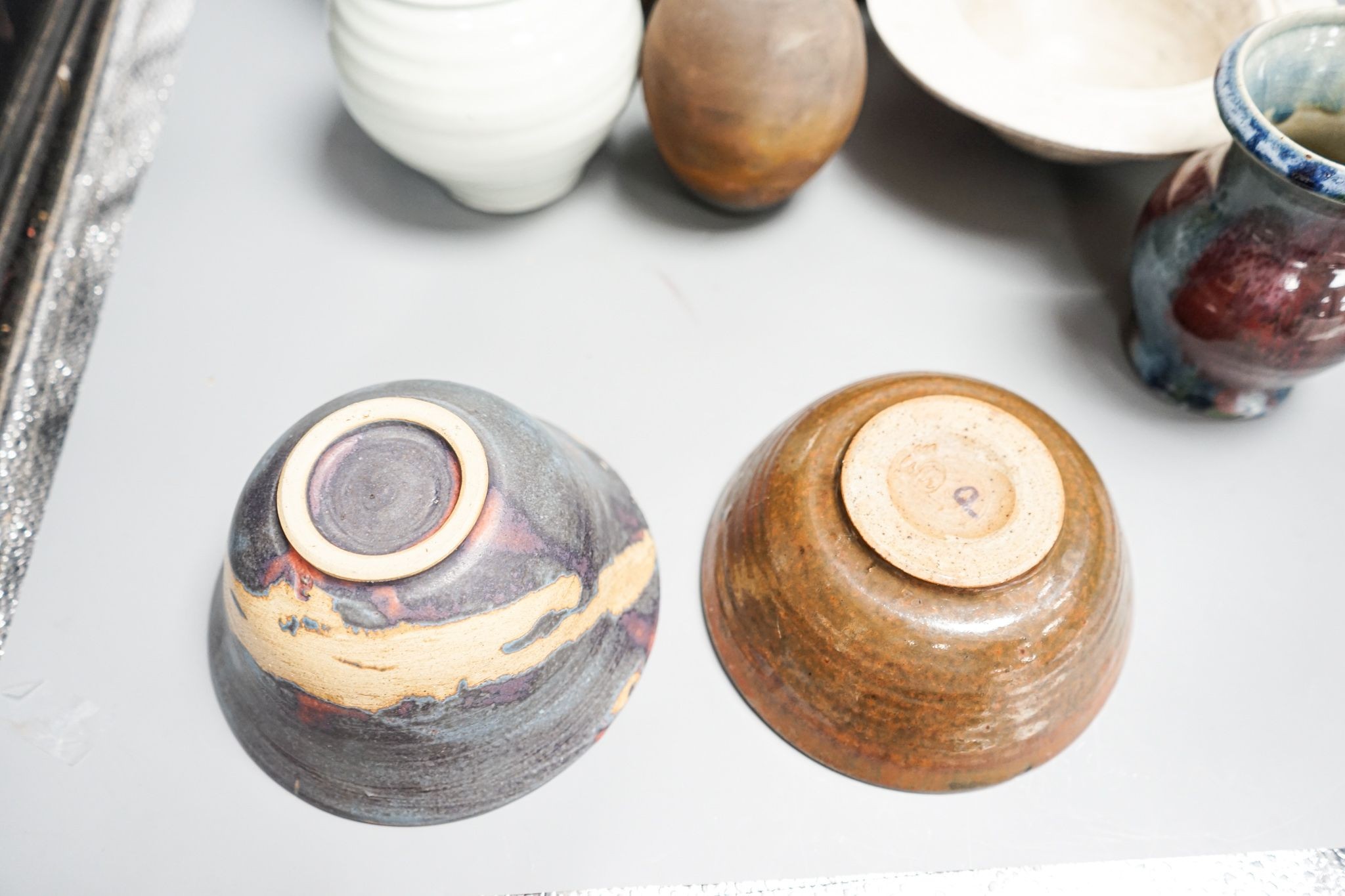 A group of studio pottery including a jar and cover, probably Norah Braden, 25 cm